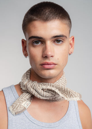 Unisex bandana in premium ultralight cotton with a bold beige and ecru duo-color design. Versatile styling accessory can be used to cover the hair, around the neck or even wrapped around the wrist as a bracelet.