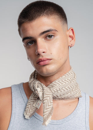 Unisex bandana in premium ultralight cotton with a bold beige and ecru duo-color design. Versatile styling accessory can be used to cover the hair, around the neck or even wrapped around the wrist as a bracelet.
