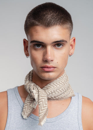 Unisex bandana in premium ultralight cotton with a bold beige and ecru duo-color design. Versatile styling accessory can be used to cover the hair, around the neck or even wrapped around the wrist as a bracelet.