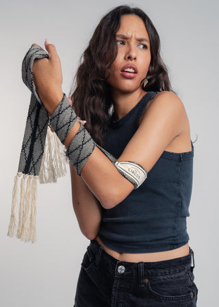 Unisex artist jacket belt in premium cotton with a bold black diamond design and hand knotted tassel finish.