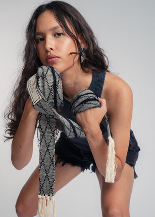 Unisex artist jacket belt in premium cotton with a bold black diamond design and hand knotted tassel finish.