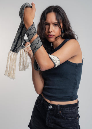 Unisex artist jacket belt in premium cotton with a bold black diamond design and hand knotted tassel finish.