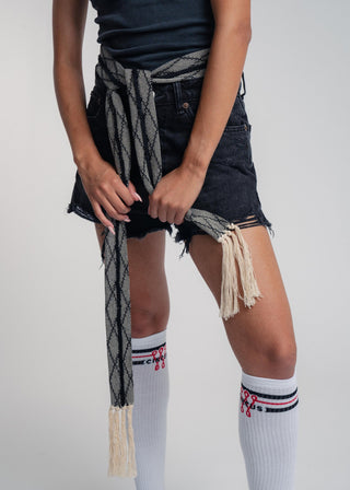 Unisex artist jacket belt in premium cotton with a bold black diamond design and hand knotted tassel finish.