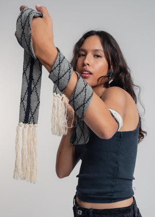 Unisex artist jacket belt in premium cotton with a bold black diamond design and hand knotted tassel finish.