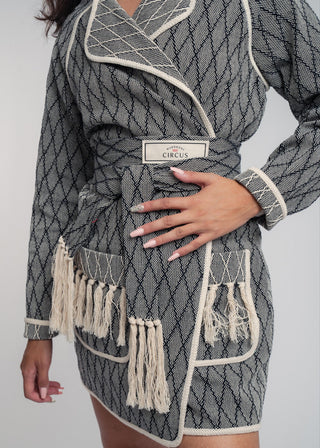 Unisex artist jacket in premium cotton with a bold black diamond design and ecru finished edges.