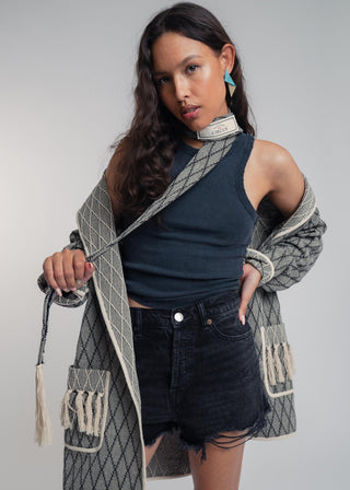 Unisex artist jacket in premium cotton with a bold black diamond design and ecru finished edges.