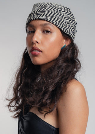 Unisex bandana in premium ultralight cotton with a bold black and ecru duo-color design. Versatile styling accessory can be used to cover the hair, around the neck or even wrapped around the wrist as a bracelet.