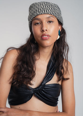 Unisex bandana in premium ultralight cotton with a bold black and ecru duo-color design. Versatile styling accessory can be used to cover the hair, around the neck or even wrapped around the wrist as a bracelet.
