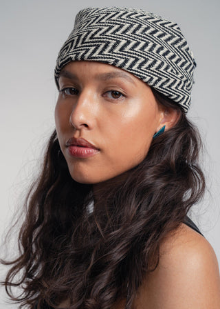 Unisex bandana in premium ultralight cotton with a bold black and ecru duo-color design. Versatile styling accessory can be used to cover the hair, around the neck or even wrapped around the wrist as a bracelet.
