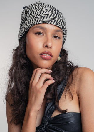 Unisex bandana in premium ultralight cotton with a bold black and ecru duo-color design. Versatile styling accessory can be used to cover the hair, around the neck or even wrapped around the wrist as a bracelet.