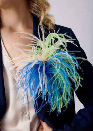 Blue unisex tri-color ostrich feather brooch accessory.