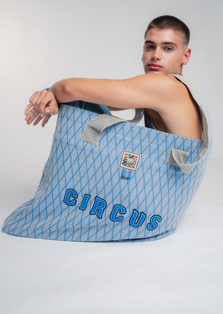 Oversized blue colored carryall made from durable all natural 4 ply cotton. Perfect for everyday shopping or weekend getaways this bag will help you organize everything.