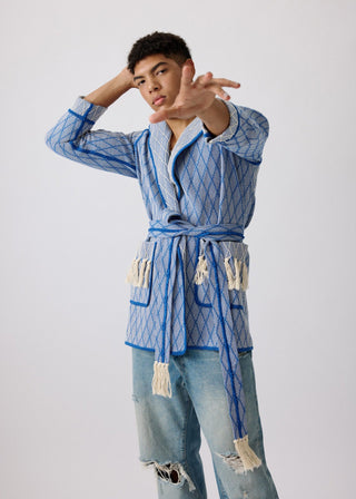 Unisex artist jacket in premium cotton with a bold blue diamond design and blue finished edges.