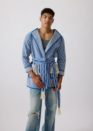 Unisex artist jacket in premium cotton with a bold blue diamond design and blue finished edges.