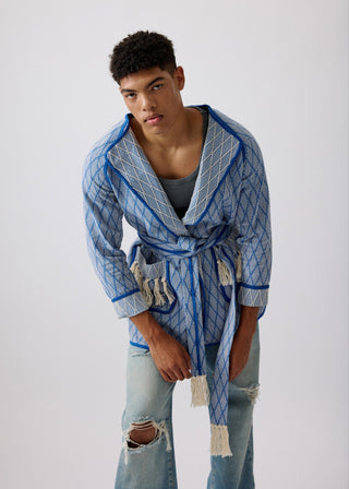 Unisex artist jacket in premium cotton with a bold blue diamond design and blue finished edges.