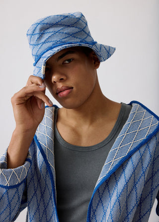 Unisex artist jacket in premium cotton with a bold blue diamond design and blue finished edges.