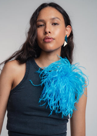 Unisex ostrich feather brooch accessory with a bold dark turkis design.