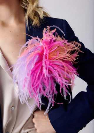 Fuchsia unisex tri-color ostrich feather brooch accessory.