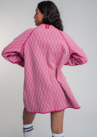 Unisex artist jacket in premium cotton with a bold fuchsia diamond design and pink finished edges.