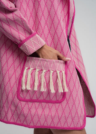 Unisex artist jacket in premium cotton with a bold fuchsia diamond design and pink finished edges.