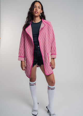 Unisex artist jacket in premium cotton with a bold fuchsia diamond design and pink finished edges.