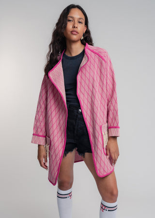 Unisex artist jacket in premium cotton with a bold fuchsia diamond design and pink finished edges.