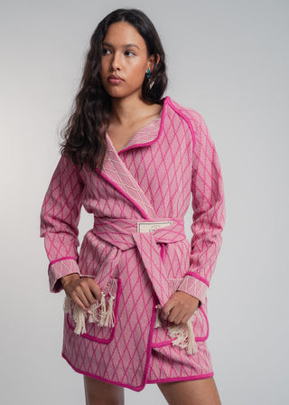 Unisex artist jacket in premium cotton with a bold fuchsia diamond design and pink finished edges.