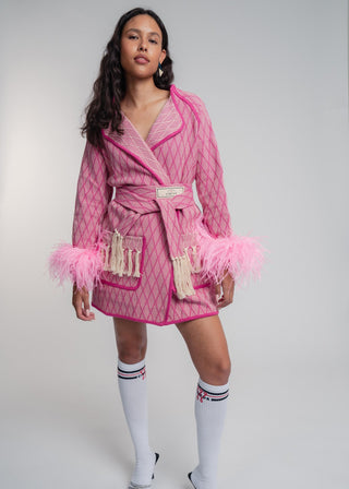 Unisex artist jacket in premium cotton with a bold fuchsia diamond design and pink finished edges.