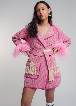 Unisex artist jacket in premium cotton with a bold fuchsia diamond design and pink finished edges.