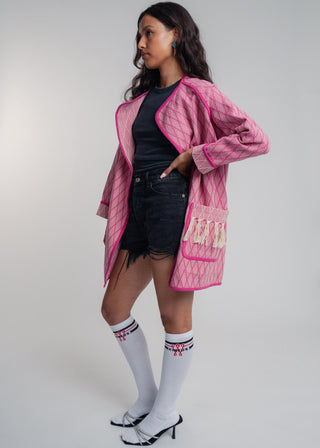 Unisex artist jacket in premium cotton with a bold fuchsia diamond design and pink finished edges.