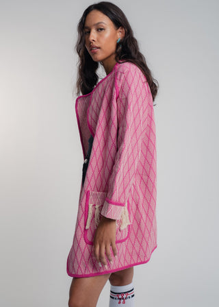 Unisex artist jacket in premium cotton with a bold fuchsia diamond design and pink finished edges.