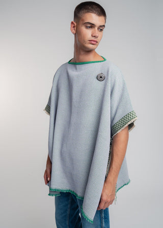 Unisex reversible poncho in premium cotton with a bold flag green and lilac duo-color design, featuring a bold statement button.
