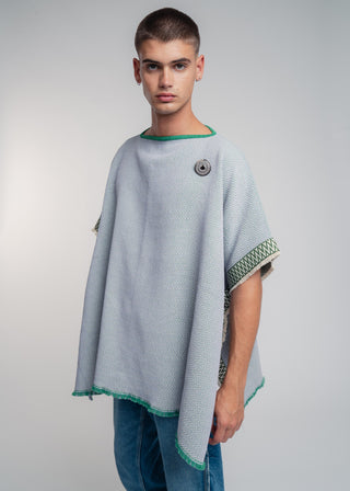 Unisex reversible poncho in premium cotton with a bold flag green and lilac duo-color design, featuring a bold statement button.