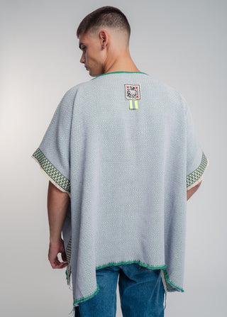 Unisex reversible poncho in premium cotton with a bold flag green and lilac duo-color design, featuring a bold statement button.