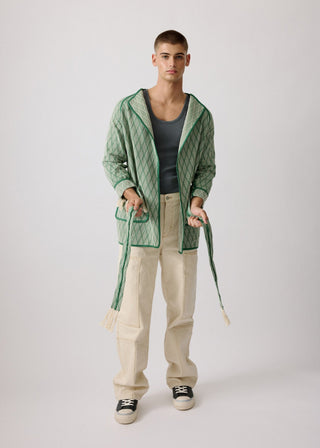 Unisex artist jacket in premium cotton with a bold green diamond design and green finished edges.