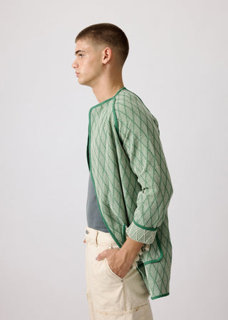 Unisex artist jacket in premium cotton with a bold green diamond design and green finished edges.