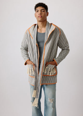 Unisex artist jacket in premium cotton with a bold grey diamond design and orange finished edges.