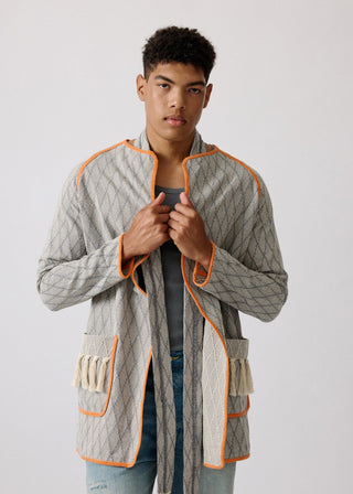 Unisex artist jacket in premium cotton with a bold grey diamond design and orange finished edges.