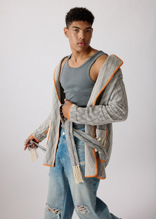 Unisex artist jacket in premium cotton with a bold grey diamond design and orange finished edges.