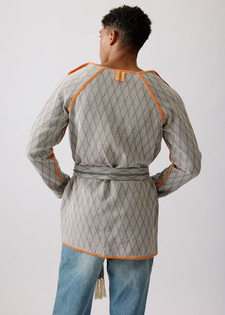 Unisex artist jacket in premium cotton with a bold grey diamond design and orange finished edges.
