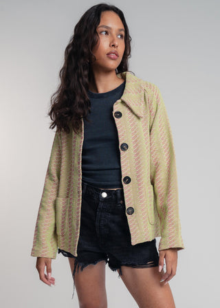 Unisex short jacket in premium cotton with a bold light green and hot pink duo-color design, featuring interchangeable buttons for a customizable look.