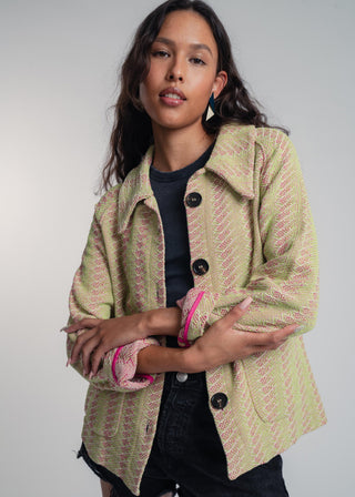 Unisex short jacket in premium cotton with a bold light green and hot pink duo-color design, featuring interchangeable buttons for a customizable look.