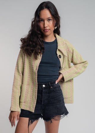 Unisex short jacket in premium cotton with a bold light green and hot pink duo-color design, featuring interchangeable buttons for a customizable look.