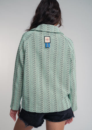Back view of a unisex short jacket in premium cotton with a bold mint and navy duo-color design, featuring interchangeable buttons for a customizable look.