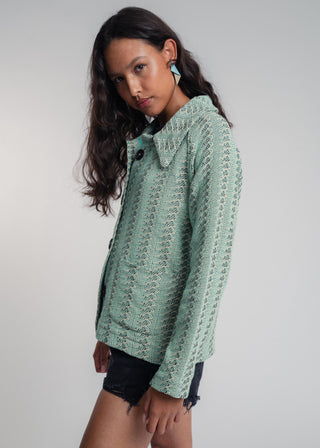 Side view of a unisex short jacket in premium cotton with a bold mint and navy duo-color design, featuring interchangeable buttons for a customizable look.