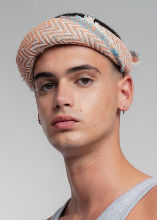 Unisex bandana in premium ultralight cotton with a bold orange and turquoise duo-color design. Versatile styling accessory can be used to cover the hair, around the neck or even wrapped around the wrist as a bracelet.