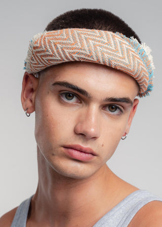 Unisex bandana in premium ultralight cotton with a bold orange and turquoise duo-color design. Versatile styling accessory can be used to cover the hair, around the neck or even wrapped around the wrist as a bracelet.