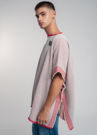 Unisex reversible poncho in premium cotton with a bold red and light gray duo-color design, featuring a bold statement button.