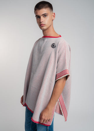Unisex reversible poncho in premium cotton with a bold red and light gray duo-color design, featuring a bold statement button.