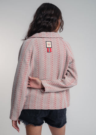 Back view of a unisex short jacket in premium cotton with a bold red and light grey duo-color design, featuring interchangeable buttons for a customizable look.